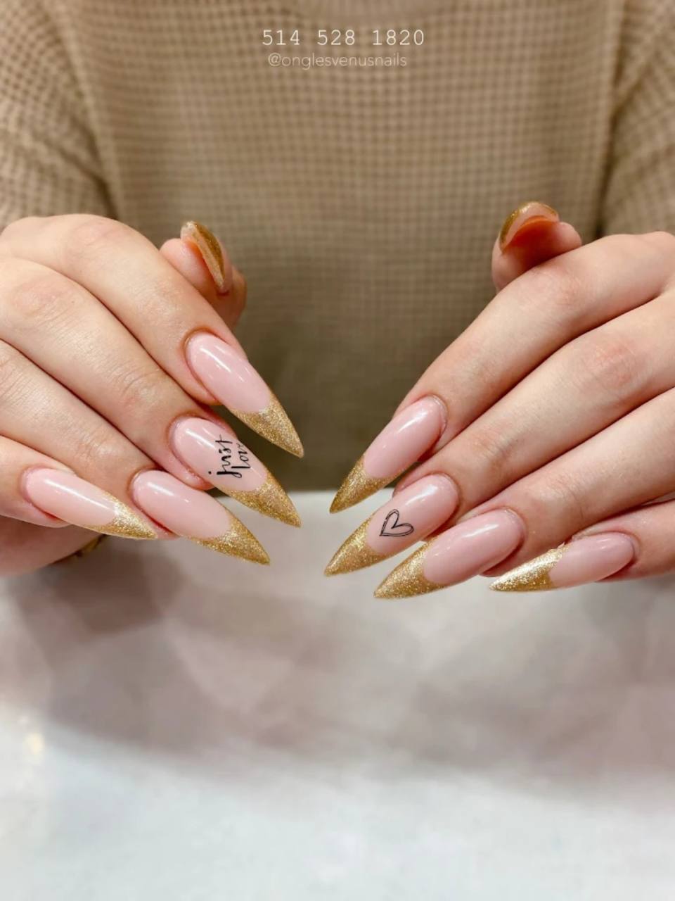 Soft nude manicure with delicate floral styling.