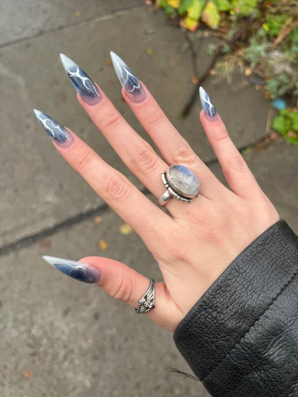 Silver blue stiletto nail design.