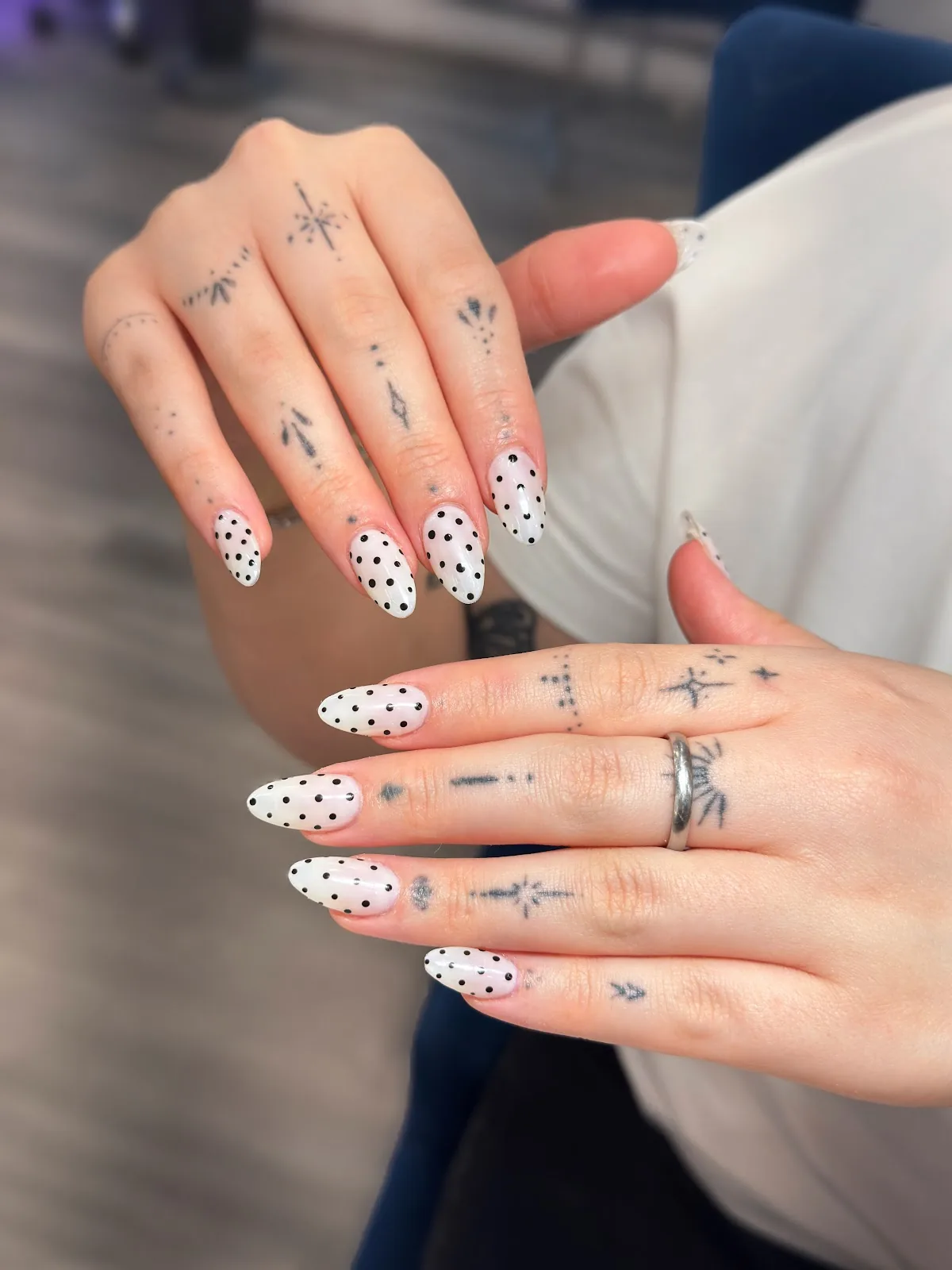 Soft nude manicure with delicate floral styling.