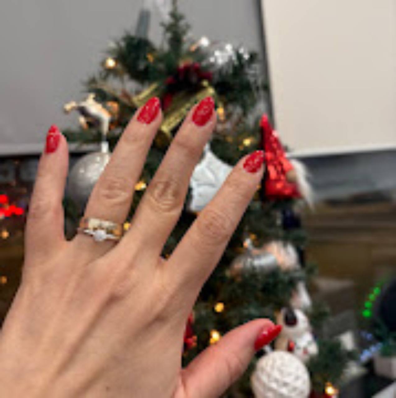 Glossy red classic manicure.