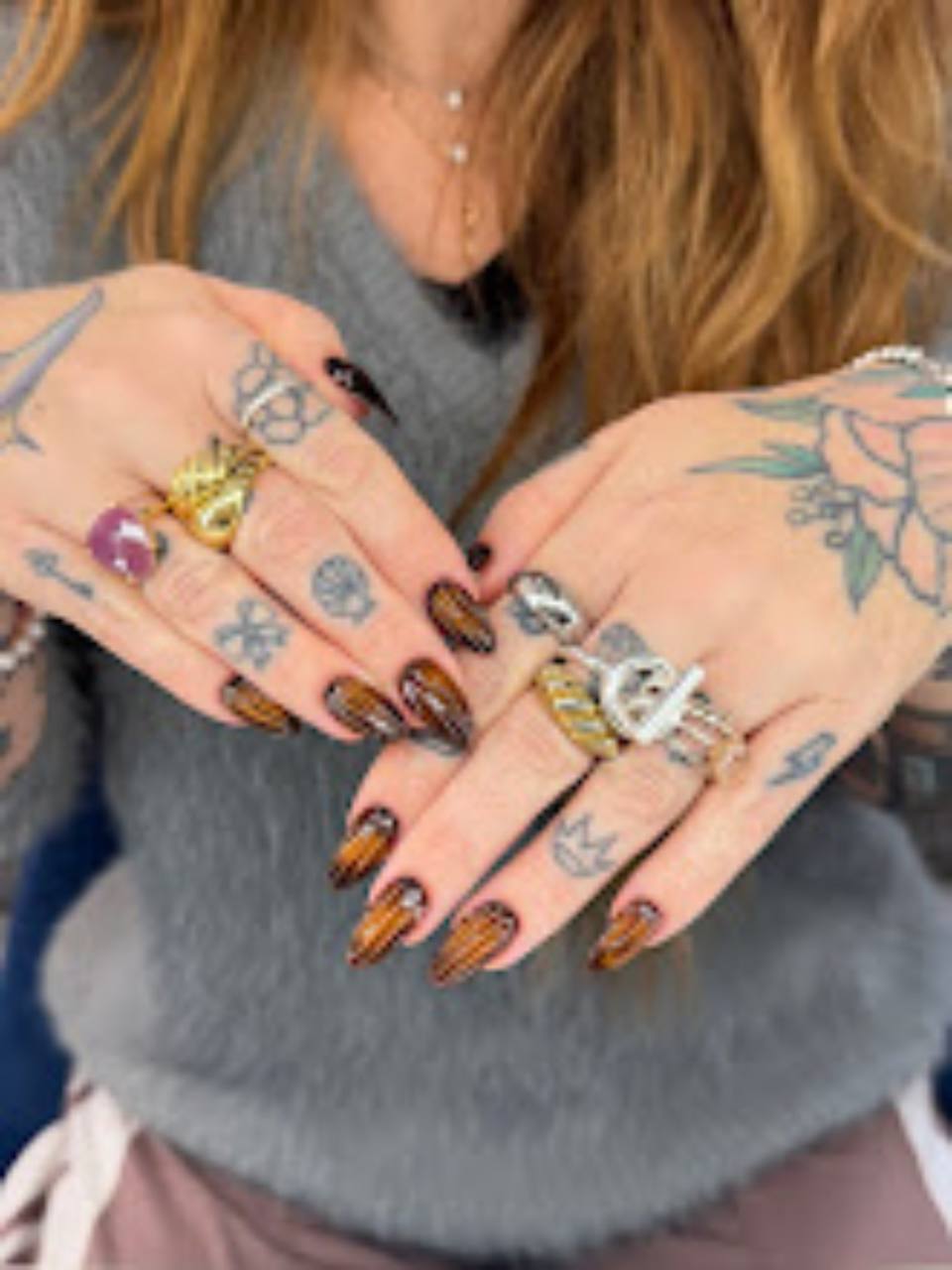 Custom nail art with detailed patterns.
